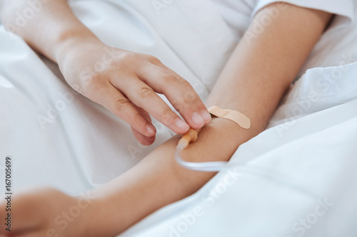 Close up of a patients hand with a catheter