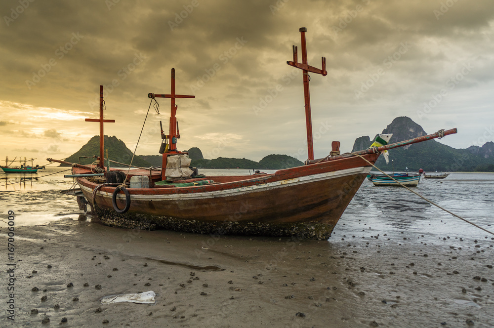 fishing boat on the beach with sea and sunrise background fishing boat on the beach with sea and sunrise background