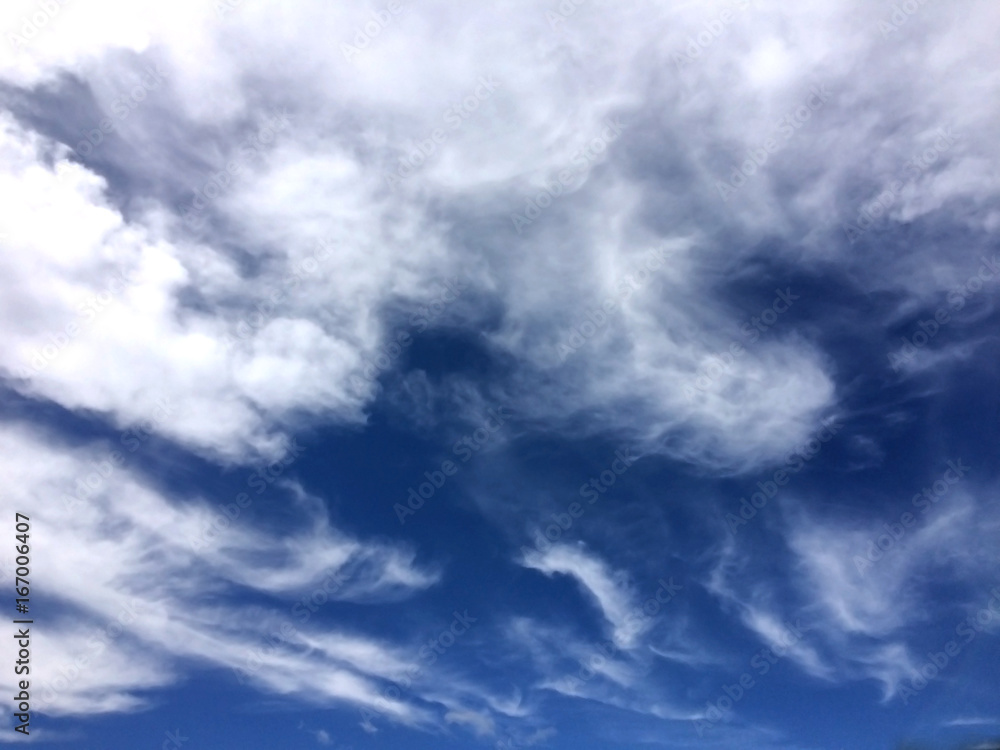 Fototapeta premium Fluffy clouds on blue sky. Background