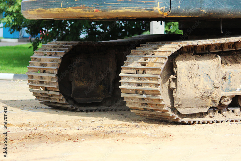 Large construction dredge who works on a road repair site. Large construction dredge who works on a road repair site.
