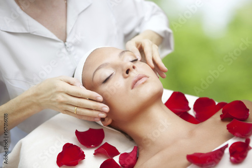 Spa salon  Young Beautiful Woman Having Facial Massage