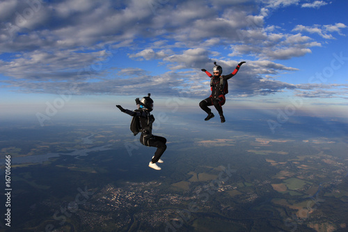 Two skydiver girls in the sky