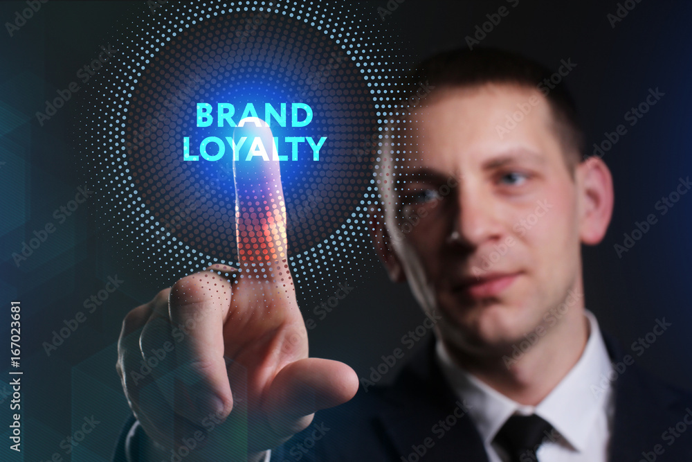 Obraz premium Business, Technology, Internet and network concept. Young businessman working on a virtual screen of the future and sees the inscription: Brand loyalty