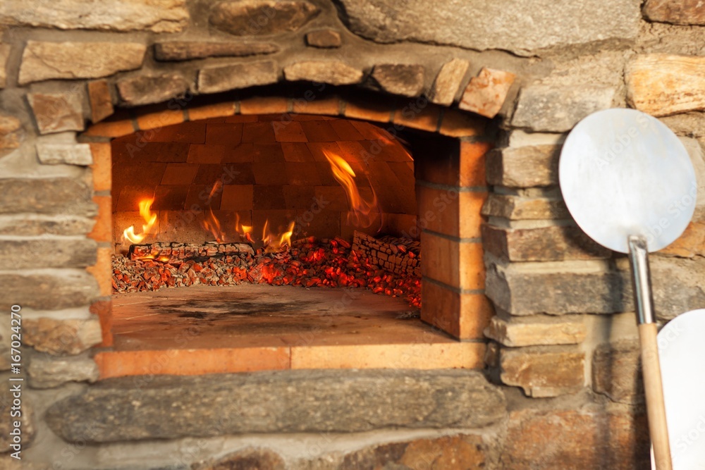 Home outdoor stone pizza oven. Traditional pizza production. Preparation of dinner. Home outdoor stone pizza oven. Traditional pizza production. Preparation of dinner.
