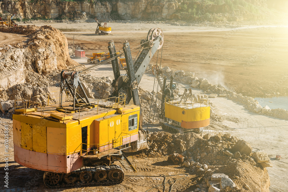 Fototapeta premium Big industrial vehicles, excavators, quarry equipment concept
