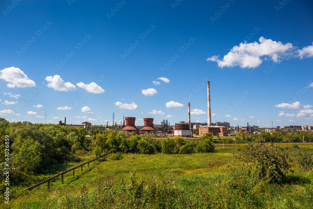 Plant for the production of synthetic rubber, the plant on nature background landscape