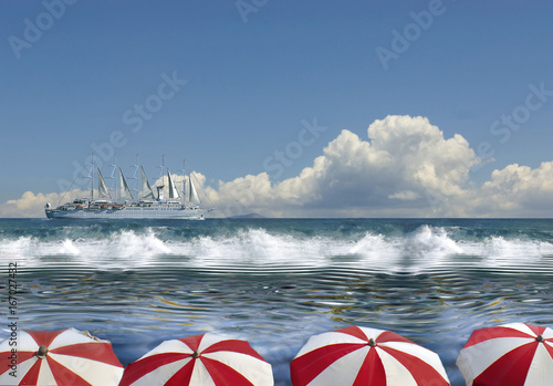 Calm and rough sea under a blu sky with beach umbrellas and a ship.