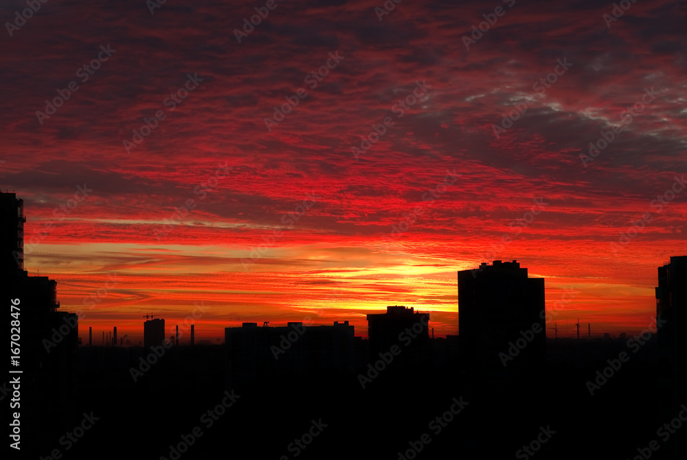 City silhouette at sunrise with colorful sky