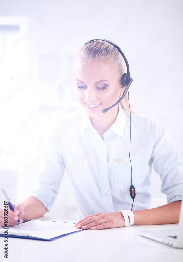 Close-up portrait of a customer service agent sitting at office Close-up portrait of a customer service agent sitting at office