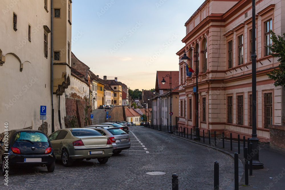 View on the street with cars on parking in the Sibiu city at Romania