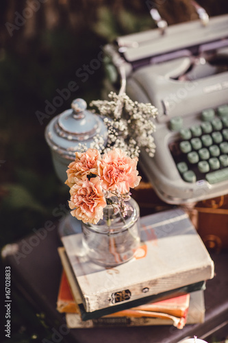 Wedding decor with flowers and candles in the forest