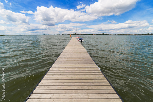 Landscape with lake in summer. Blue sky