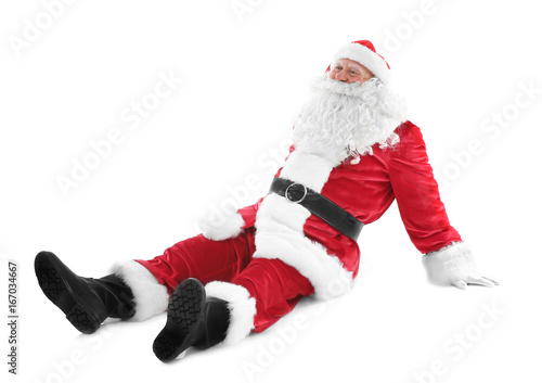 Happy authentic Santa Claus sitting against white background