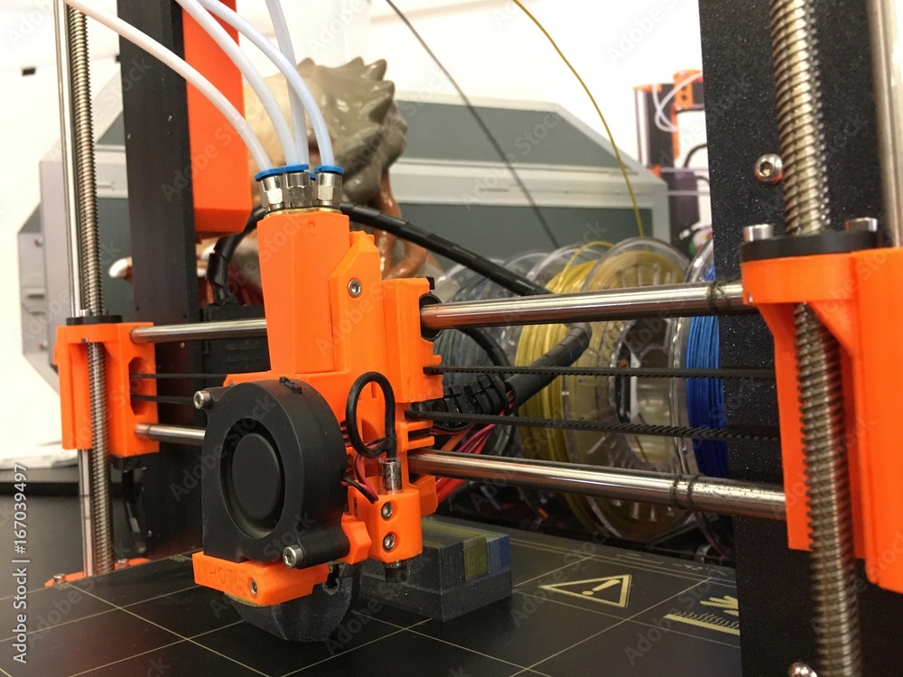 3D Printing Machine printing a piece of plastic. Working 3d printer. 3D Printing Machine printing a piece of plastic. Working 3d printer.