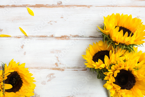 Fototapeta Naklejka Na Ścianę i Meble -  Yellow Sunflower Bouquet on White Rustic Background