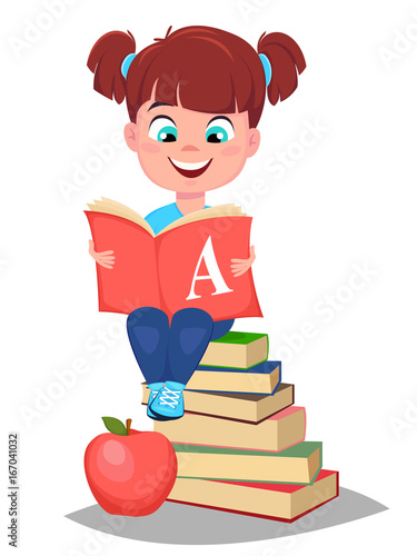 Cute girl holding primer and sitting on a stack of books. Pretty little schoolgirl.