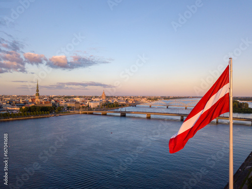 Beautiful aerial sunset view over AB dam in Riga Latvia with a huge Latvian flag photo