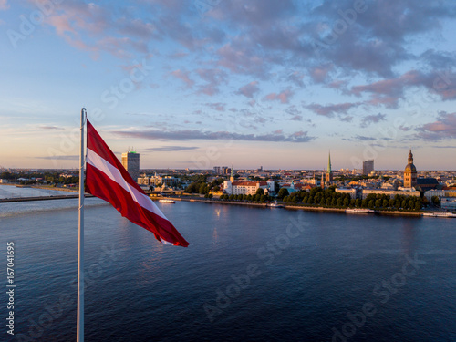 Obraz na płótnie Beautiful aerial sunset view over AB dam in Riga Latvia with a huge Latvian flag