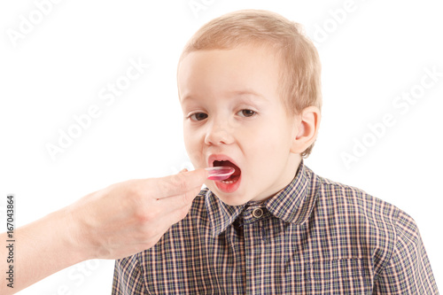 Pediatrician examining little child throat