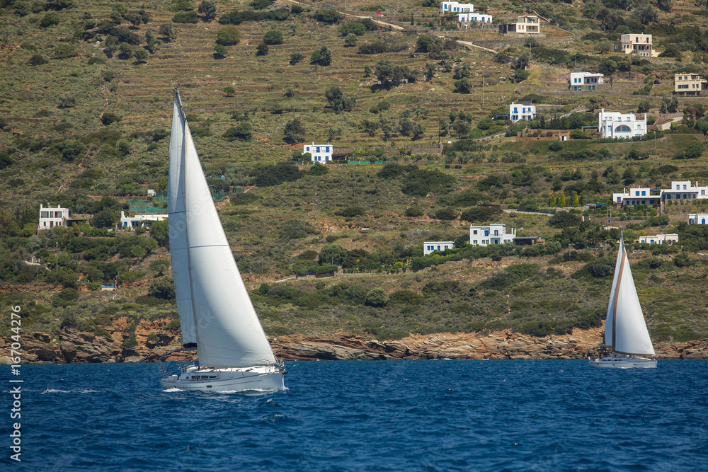 Obraz premium Ship yachts with white sails in the open Sea. Sailing. Luxury boats.