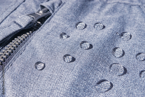 rain drops on waterproof clothing © PabloStock