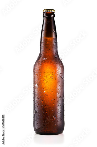 Bottle of beer with drops and ice pieces isolated on white background