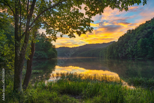 summer sunset over calm lake, appalachian mountains, kentucky photo