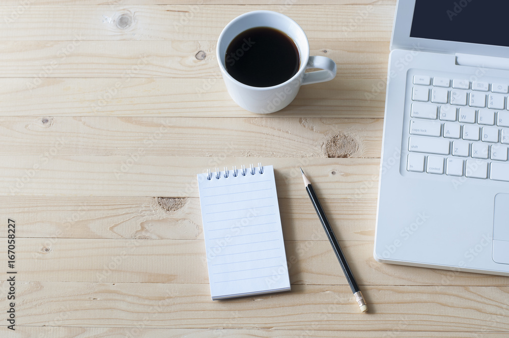 Notebook,pencil,laptop and coffee on wooden table. Notebook,pencil,laptop and coffee on wooden table.