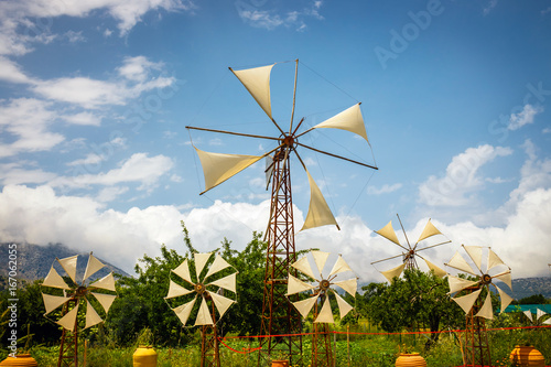 Old-style windmills used as touristic attraction on Lasithi Plateau. Crete, Greece photo