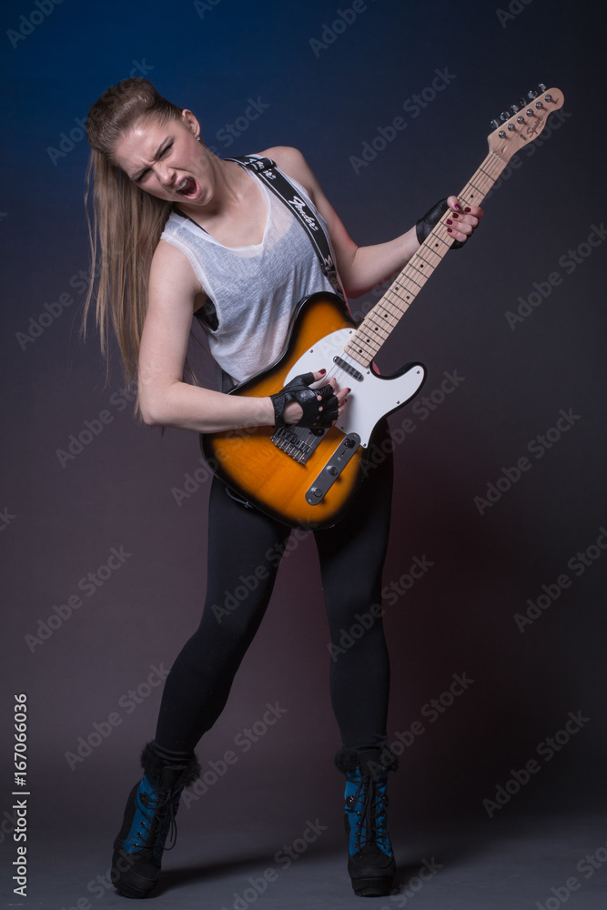 Girl with guitar at the rehearsal before the performance Girl with guitar at the rehearsal before the performance