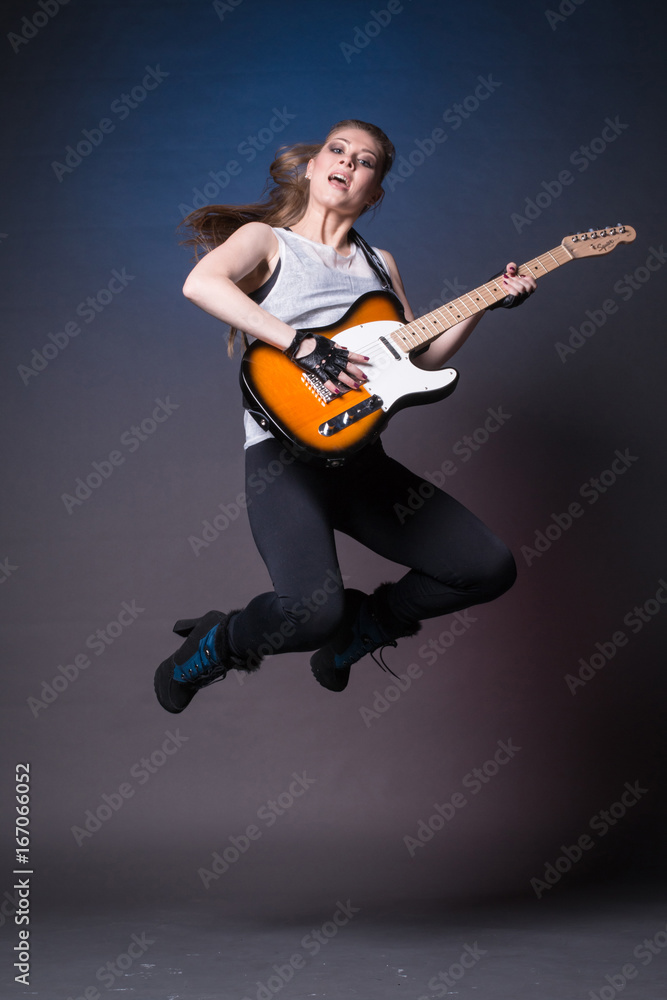 Girl with guitar at the rehearsal before the performance