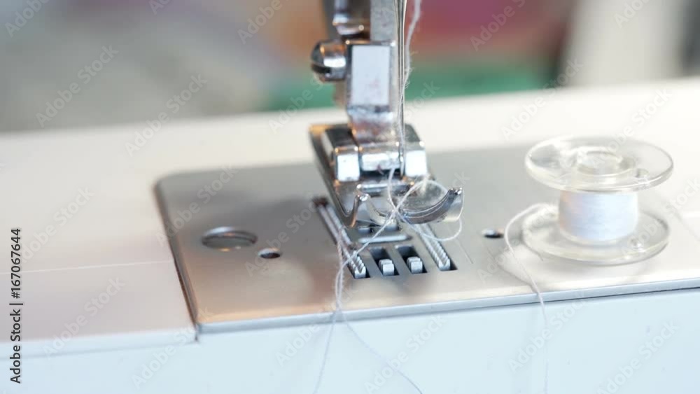 View of sewing machine and thread, steadycam shot
View of sewing machine and thread, steadycam shot