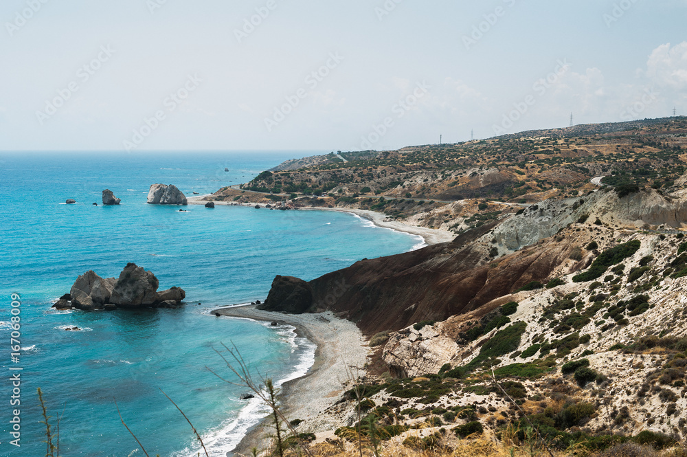 The mountains and the sea from a height. Seascape. Beautiful coast of Cyprus. Aphrodite Bay in Cyprus. Aphrodite's rock in Cyprus. The Beach Of Aphrodite