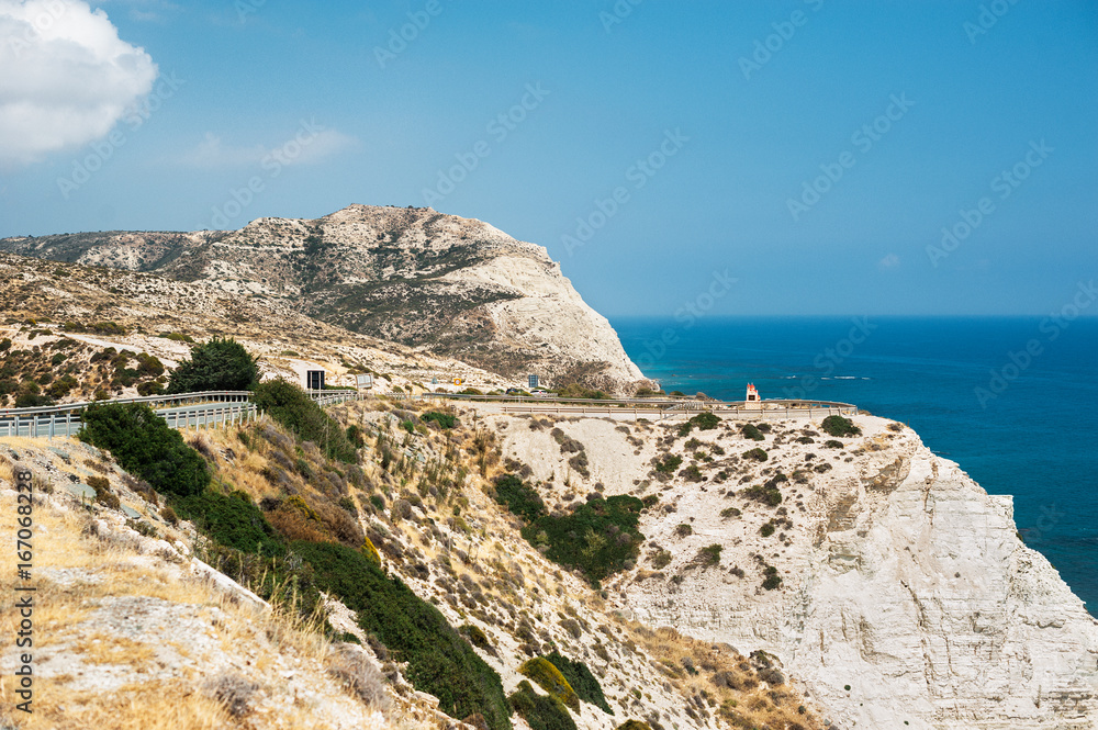 The mountains, the sea, the sky and the road. Beautiful mountains in the Mediterranean sea. Seascape. Beautiful coast of Cyprus. Sky, mountains, sea. Road along the sea