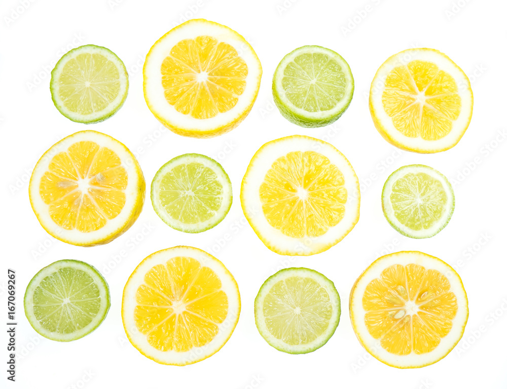 Yellow and green lemon and lime slices on white background