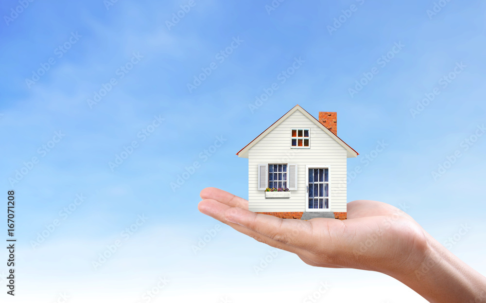 Mortgage concept by house in hand Mortgage concept by house in hand