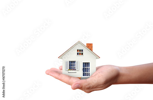 Mortgage concept by house  in hand photo