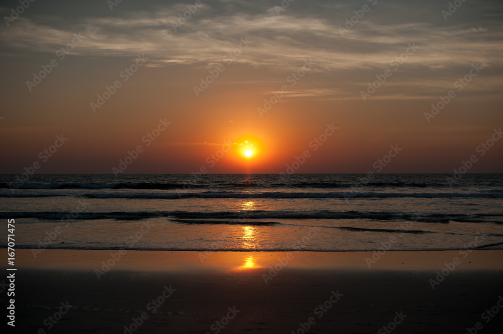 Beautiful sunset on the sea in Asia. Evening beach in Goa. Asian Beaches. Warm sun. Landscapes Of Asia