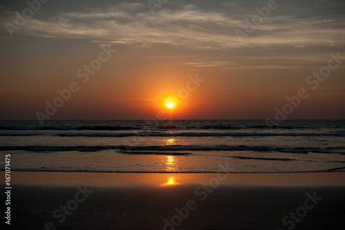 Beautiful sunset on the sea in Asia. Evening beach in Goa. Asian Beaches. Warm sun. Landscapes Of Asia