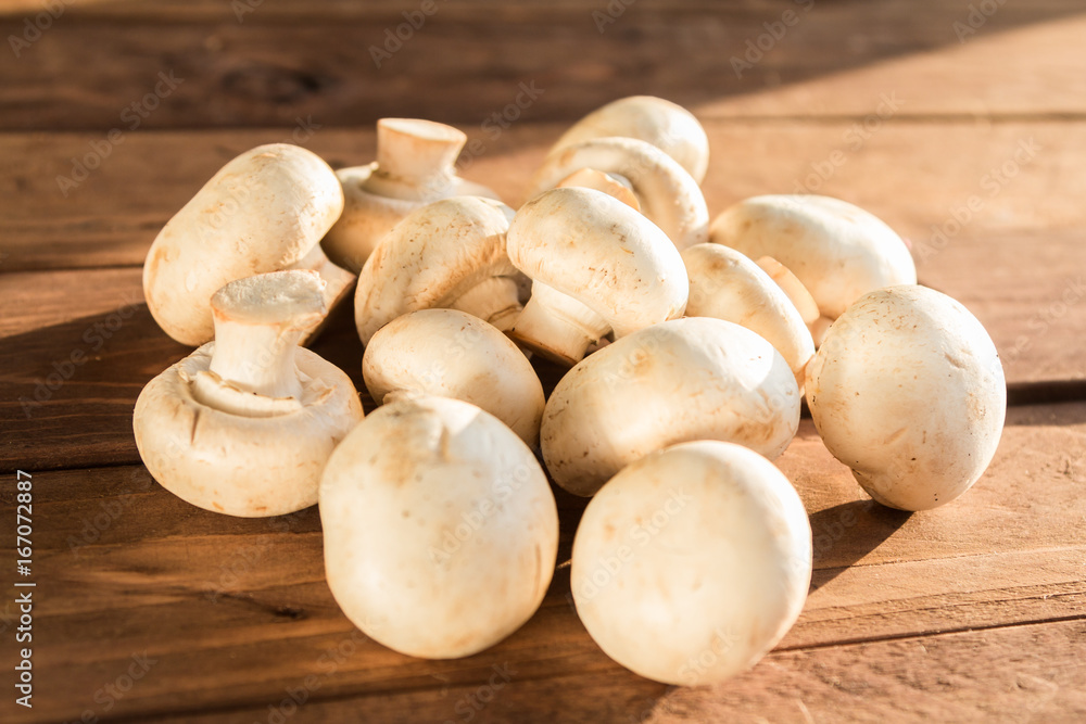 Mushrooms champignons in a basket Mushrooms champignons in a basket