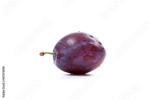 Ripe plum with water drops isolated on white background..