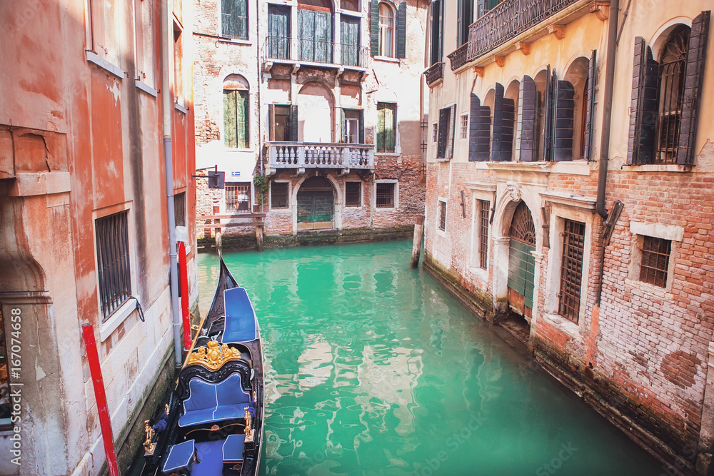 Venice, Italy. Gondola on the canal on a sunny day.