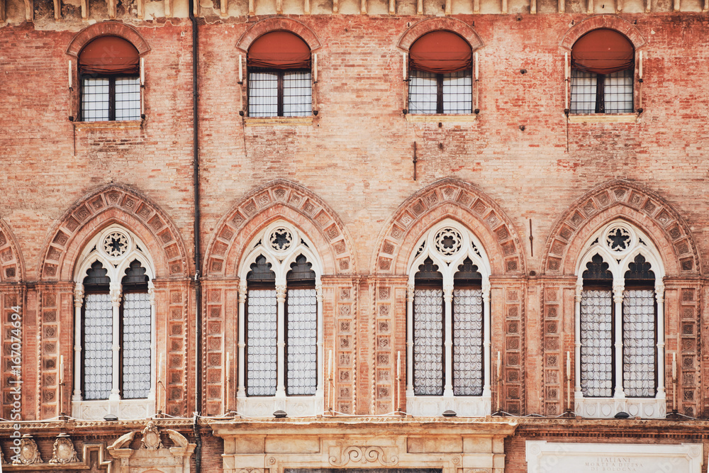 Bologna, Italy. Windows on the wall of the Palazzo Communale