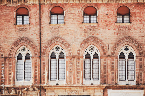Bologna, Italy. Windows on the wall of the Palazzo Communale