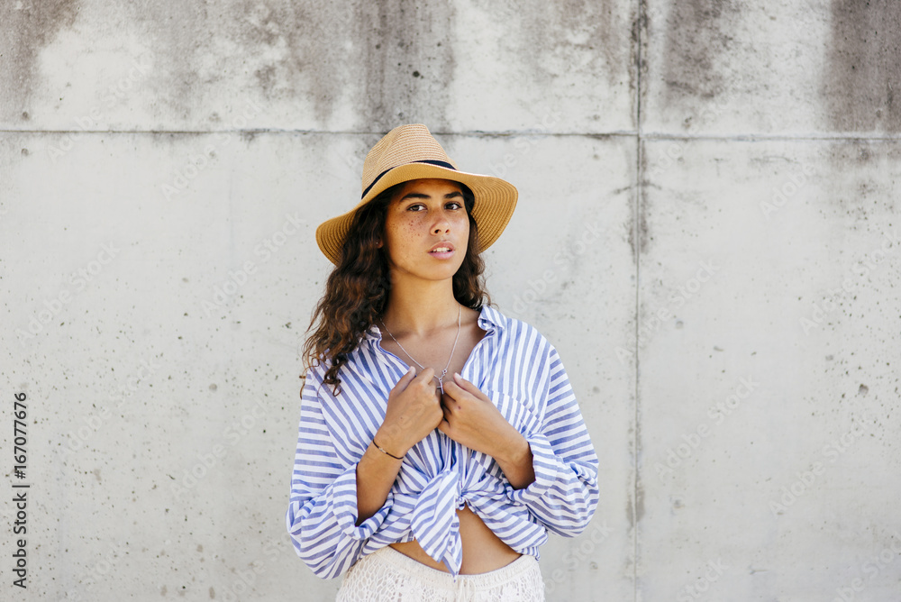 Young woman at concrete wall Young woman at concrete wall