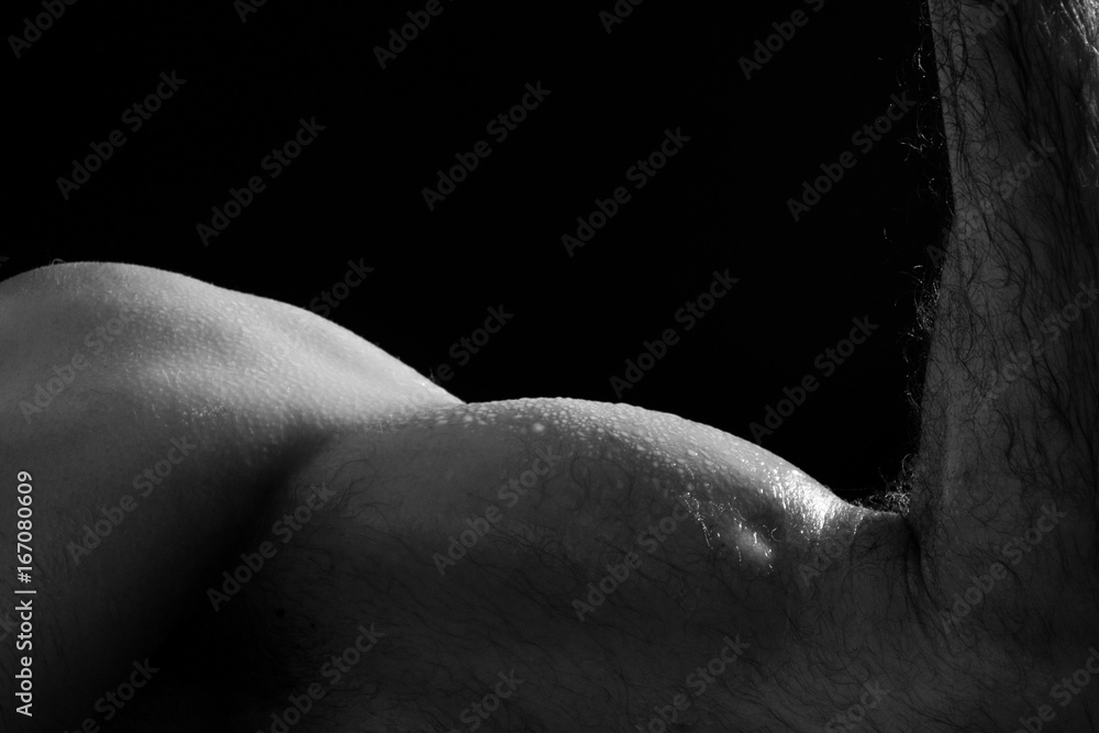 Naklejka premium Closeup of arm on black background