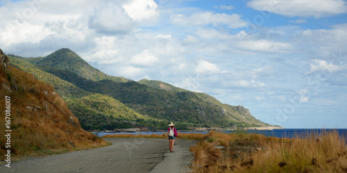 Photography Tourist admiring views on of the roads with a most view on the Cuban coast at th