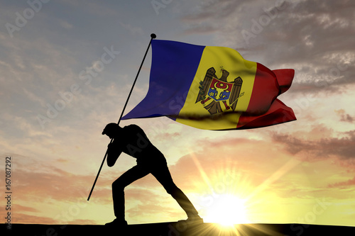 Moldova flag being pushed into the ground by a male silhouette. 3D Rendering