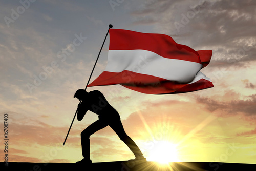 Austria flag being pushed into the ground by a male silhouette. 3D Rendering