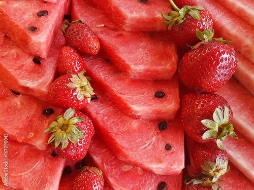 tile of sliced watermelons and strawberries